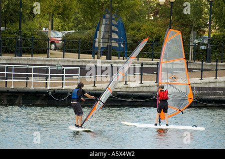 Students learning to windsurf at the Salford Watersports Centre, Ontario Basin, Salford Quays, Greater Manchester, UK Stock Photo