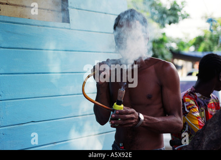 jamaica vap smoke Man smoking bong in Kingston Stock Photo Flavor:Fruit vuse alto charging lights Cloud Canada
