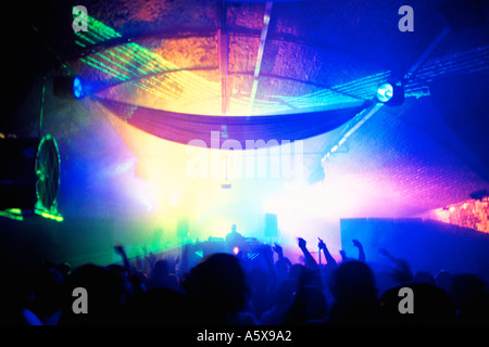 Crowd dancing under lasers at XPRS YRSLF SE1 Arches London Stock Photo