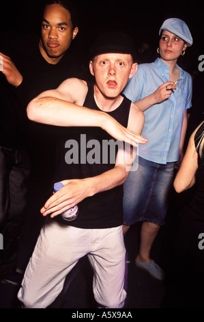 Ravers in crowd dancing at XPRS YRSLF SE1 Arches London Stock Photo