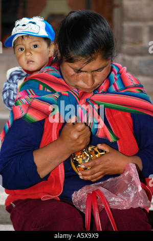 Street vendor with her child, Cusco, Peru, South America Stock Photo