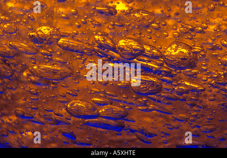 Macrophotography of air bubbles trapped into a gel. Macrophotographie de bulles d'air prises dans un gel. Stock Photo
