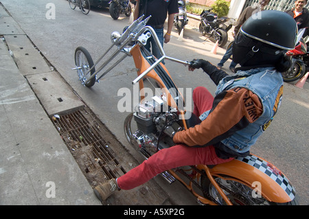 A Thai biker on his chopper motorcycle during a bikie meeting in Nong Khai, Thailand. Stock Photo