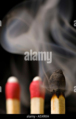 smoldering burned out matchstick Stock Photo