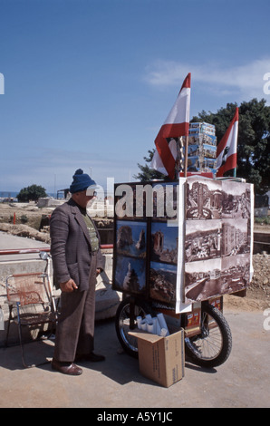 Beirut Old Green Line Man selling posters representing Beirut before the civil war Stock Photo