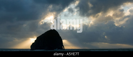 Haystack Rock and arch at sunset, Cape Kiwanda, Oregon Coast PANORAMIC Stock Photo