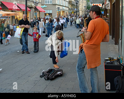 street musician on the pedestrian area Kettwiger Strasse Street in Essen Germany Stock Photo