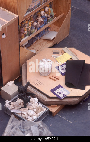 Museum objects — statue and polychrome ceramic panel — in wooden packing cases being prepared for removal, London, England Stock Photo