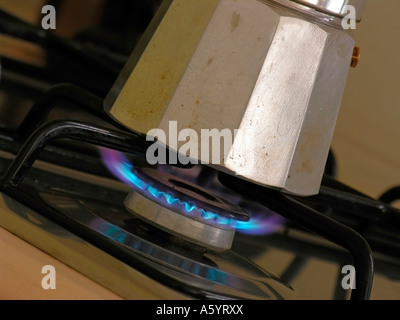 traditional aluminium espresso cooker on gas flame Stock Photo