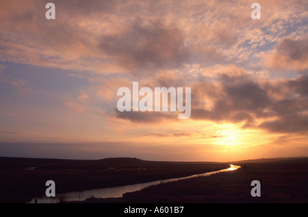 DAWN AT WEYBOURNE WITH LIGHT REFLECTING ON WATER SMALL RIVER NORTH NORFOLK EAST ANGLIA ENGLAND UK Stock Photo