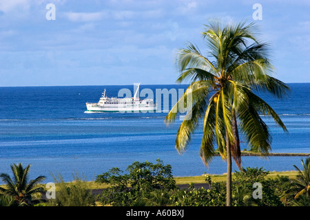 A ferry boat travels from the island of Moorea to the city of Papeete Tahiti Stock Photo