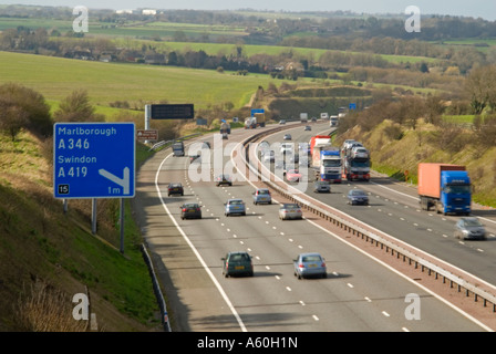 Horizontal wide angle aerial view of traffic speeding along the M4 motorway on a bright sunny day. Stock Photo