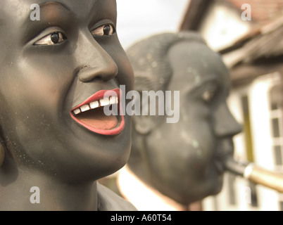 Profiles of two jazz musicians in action - sculptured in black stone, outside in a sculpture garden. Stock Photo