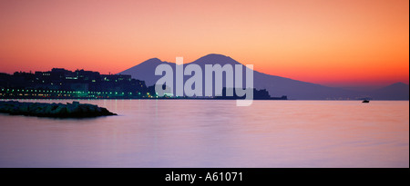 Vesuvius at Sunrise viewed from Posilipo across Naples Bay with Castel dell'Ovo in the middle distance Stock Photo