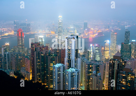 Hong Kong Island. Dusk view from Victoria Peak over city centre skyscrapers and Hong Kong Harbour to Kowloon shore Stock Photo