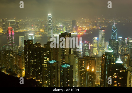 Hong Kong Island. Evening night view from Victoria Peak over city centre skyscrapers and Hong Kong Harbour to Kowloon shore Stock Photo