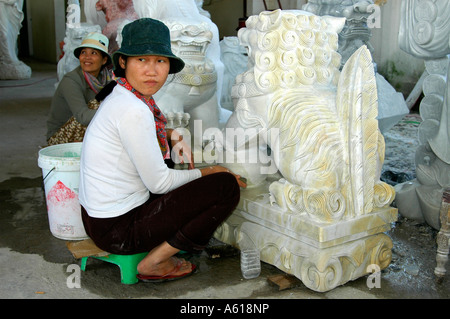 Craftsperson in a marble carving manufacture, Marble Mountains near Danang, Vietnam Stock Photo