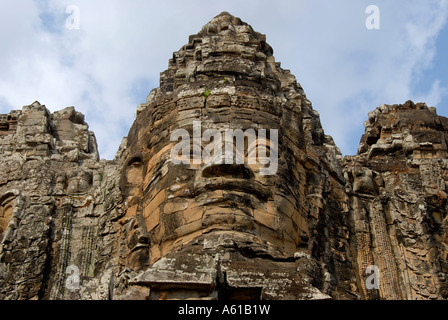 Avalokiteshvara face of a Khmer stone figure above South Gate Angkor Thom Siem Reap Cambodia Stock Photo