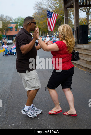 Mixed Race Couple dancing Latin street dance in Old Town Florida USA Stock Photo
