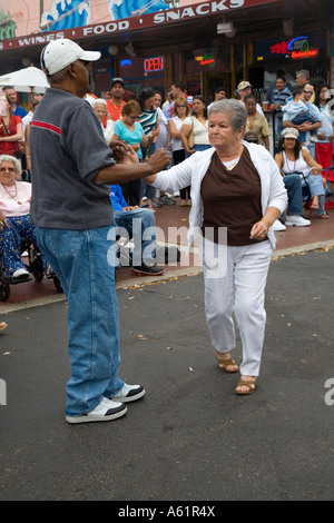 Mixed-Race Couple dancing Latin street dance in Old Town Florida USA Stock Photo