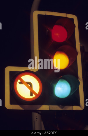time exposure of traffic light showing red amber and green lights at night Leeds Yorkshire UK Stock Photo