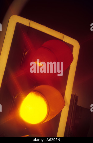 red and amber lights showing on traffic light at night Leeds Yorkshire UK Stock Photo
