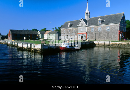 Boat moored in front of church, Shelburne, Nova Scotia, Canada Stock Photo