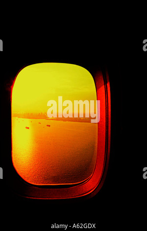 View from airliner window at sunset Stock Photo