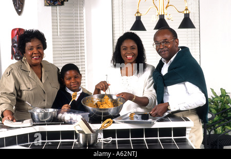 Black african american three generation family together happy at home in kitchen enjoying each other and relaxing Stock Photo