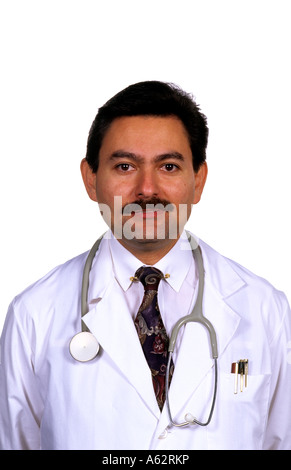 Portrait of professional hispanic medical doctor in white coat and against bright white background Stock Photo