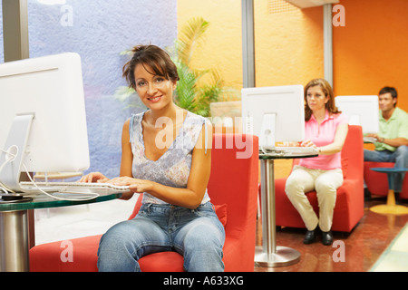 Three office workers working in an office Stock Photo