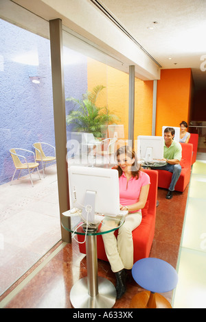 Three office workers working in an office Stock Photo