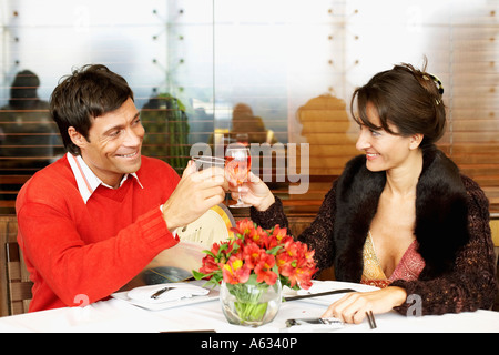 Mid adult couple toasting with wine glasses Stock Photo
