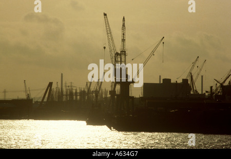 Silhouette of cranes at port, Hamburg, Germany Stock Photo