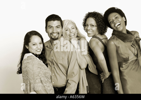 Portrait of five people standing in a row and smiling Stock Photo
