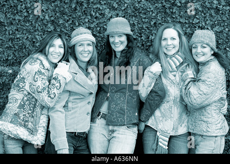 Portrait of five young women smiling Stock Photo