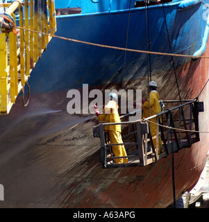 Shipping industry.Cleaning ship in dry dock. Cape Town South Africa Stock Photo