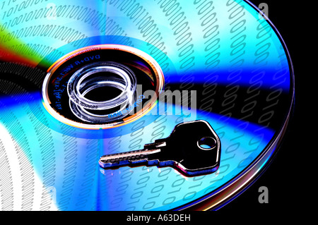 Concept data security, single DVD with key isolated on black baclground Stock Photo