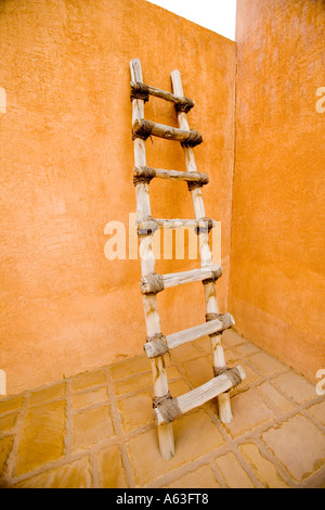 Al-Ain's Palace Museum - Ladder exhibit propped against a wall.in a quiet corner.(Al Ain) Stock Photo