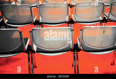 Rear view of empty chairs in rows Stock Photo