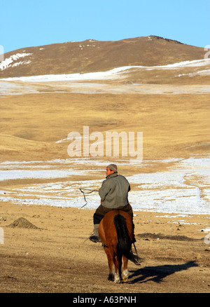 Horse riders in Mongolian steppe Stock Photo - Alamy