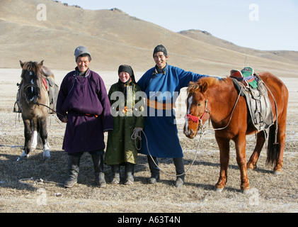 A Mongol herdsman with his herd of horses in the vast Mongolian ...