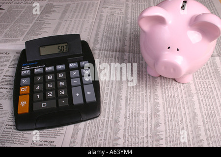 Markets journal with a calculator and a piggy bank Stock Photo