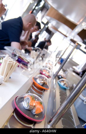 Conveyor belt at Yo Sushi restaurant, UK Stock Photo