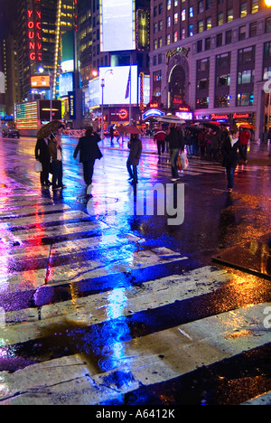 New York City Times Square At Night In The Rain With Bright Lights And Reflections, New York, USA Stock Photo
