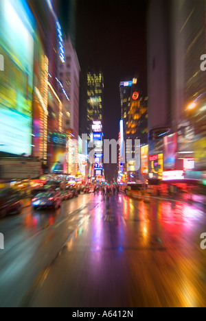 New York City Times Square At Night In The Rain With Bright Lights And Reflections, New York, USA Stock Photo