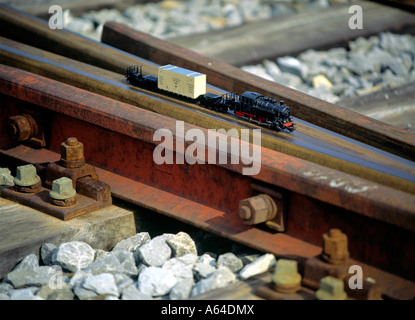 scale model of cargo train crossing railroad track editorial use only Stock Photo