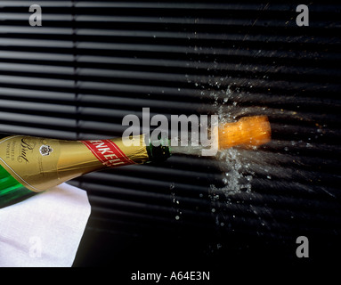 cork popping out of champagne bottle editorial use only Stock Photo