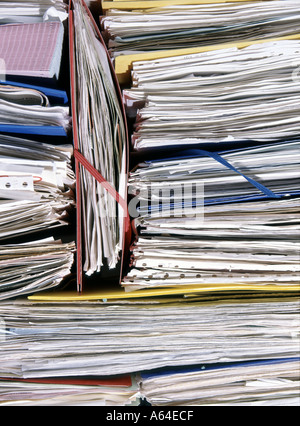 Data protection Act paperwork files folders business papers document paperwork records folders pile heap office on view & accessible poor security UK Stock Photo