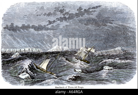 Sailing-ships in the Strait of Magellan rounding Cape Horn in sight of Tierra del Fuego. Hand-colored woodcut
